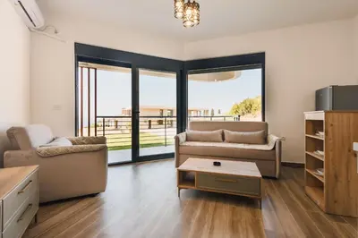 a living room with a couch and a table at SeaSide Luxury Apartments in Ulcinj