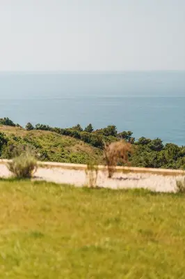 a dirt road with the ocean in the background at SeaSide Luxury Apartments in Ulcinj