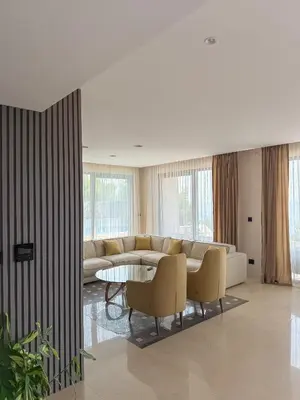 a living room with a couch and a table and chairs at Villa Patria in Budva