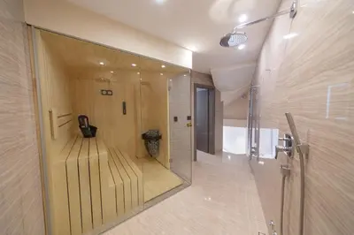 a large mirror in a bathroom with a toilet at Villa Patria in Budva