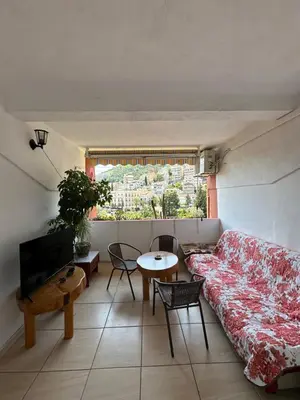 a living room with a couch and a table at Apartman Budva Centar in Budva