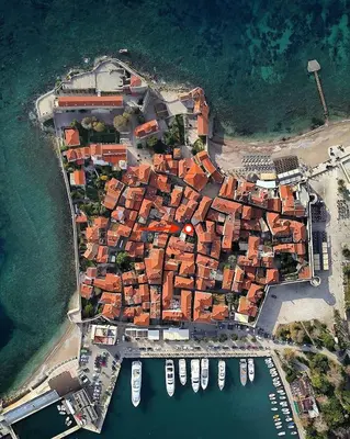 an aerial view of a town with boats in a harbor at Charming Apartment in The Old Town in Budva