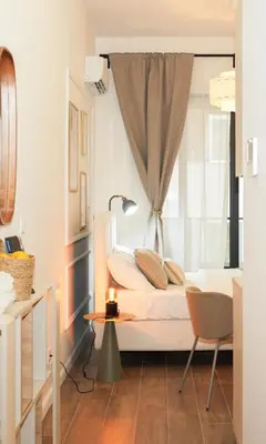 a bedroom with a bed with a window at Helen studio apartment in Kotor