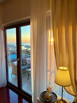 a room with a window with a view of a balcony at Mia Bella in Bar