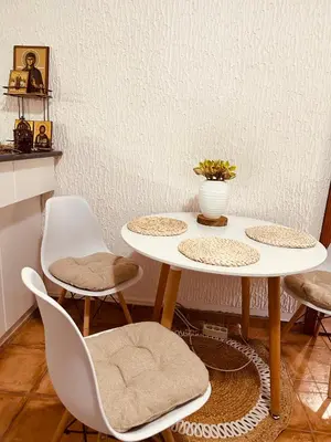 a white table and chairs in a room at Levant in Sutomore