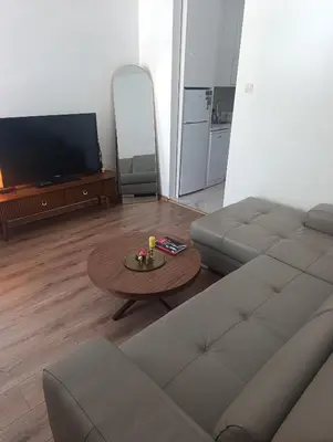 a living room with a couch and a table at Sofi in Sutomore