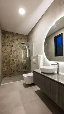 a bathroom with a sink and a toilet and a tv at Villa Amara -Luxury Villa with Private Pool & Hot Tub in Bar