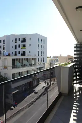 a balcony with a view of a street and buildings at AMD - stan 211 in Bar