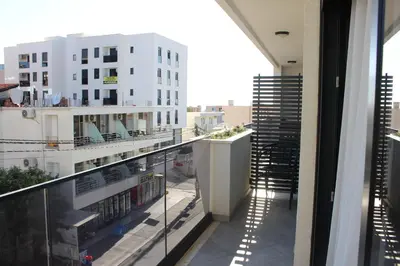 an apartment balcony with a view of a building at AMD - stan 211 in Bar