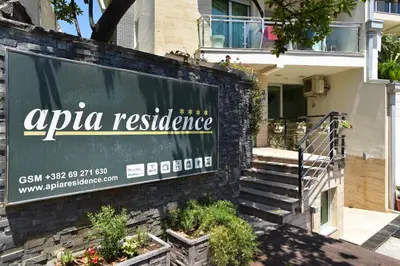 a sign for an apula residence in front of a building at Omega 4 Apartment in Budva