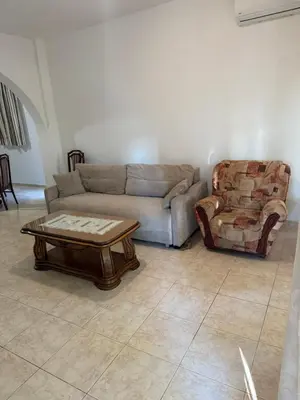 a living room with a couch and a chair at Stuart Žukotrlica in Bar