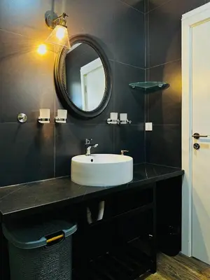 a bathroom with a sink and a mirror at GlamSea in Bar