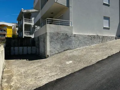 an empty street next to a building at GlamSea in Bar