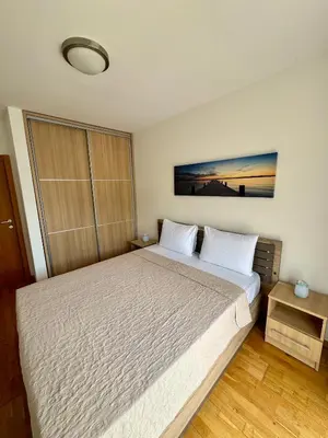 a bedroom with a large bed in a room at Infinity Apartment Blue Horizont Przno in Kravlja