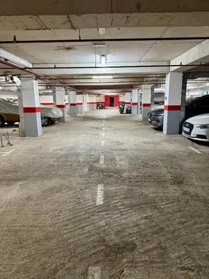 an empty parking garage with cars parked in it at Infinity Apartment Blue Horizont Przno in Kravlja