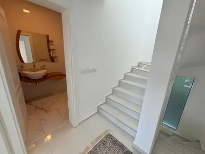 a staircase in a bathroom with a sink and a mirror at Villa Diel 300m vom Strand in Utjeha