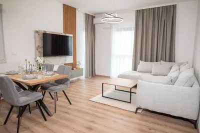 a living room with a couch and a table at Amarea Apartments in Ulcinj