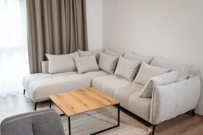 a living room with a couch and a coffee table at Amarea Apartments in Ulcinj