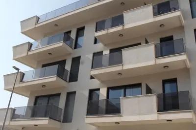 an apartment building with balconies on the side at AMD - studio104 in Dobra Voda