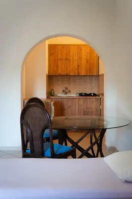 a kitchen with a table and a counter top at Apartments Noki in Ulcinj