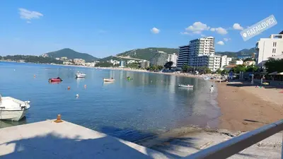 a view of a beach with boats in the water at Apartment Vidakovic in Budva