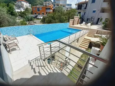 a staircase leading to a swimming pool in a building at Villa Nuna in Bar