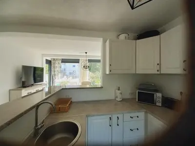 a kitchen with a sink and a microwave at Villa Nuna in Bar