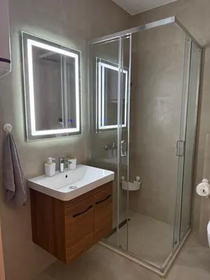 a bathroom with a sink and a shower at Apartmani Stefanos - Jaz in Budva
