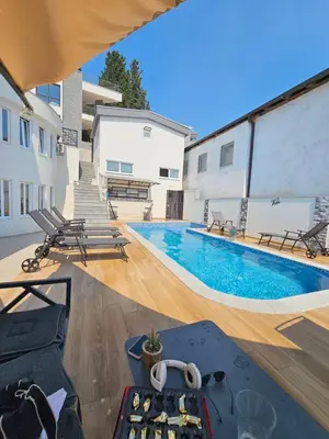 a view of a swimming pool in a building at Vila Eden in Bar