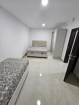 a bedroom with two beds in a room at Vila Eden in Bar