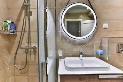 a bathroom with a sink and a mirror at Bar- Apartment Prestige in Bjeliši