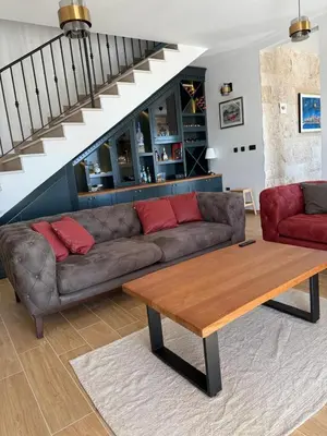 a living room with a couch and a table at Villa Maluso in Budva