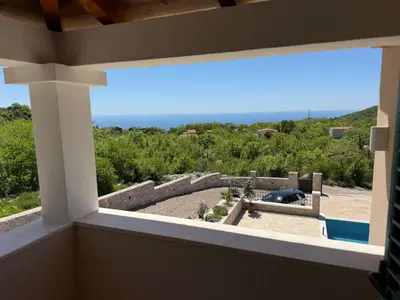 a view of the ocean from a room with a window at Villa Maluso in Budva