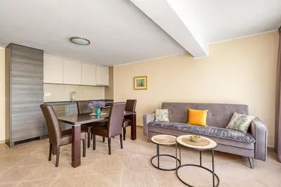 a living room with a couch and a table at Spacious Comfort in Boreti