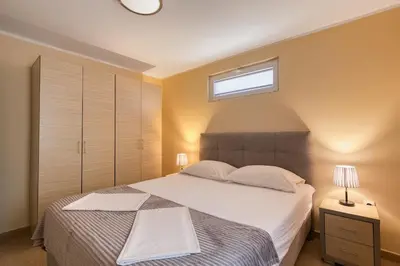 a bedroom with a large bed and a window at Spacious Comfort in Boreti