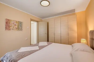 a bedroom with a large white bed in a room at Spacious Comfort in Boreti