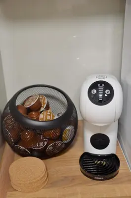 a food processor next to a basket of bread at Cozy one bedroom apartment with parking in Petrovac na Moru