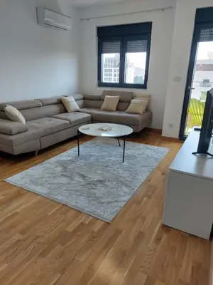 a living room with a couch and a coffee table at Adriatic Glam in Bar