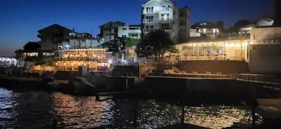 a view of a city at night with lights at Fidel Apartment in Utjeha