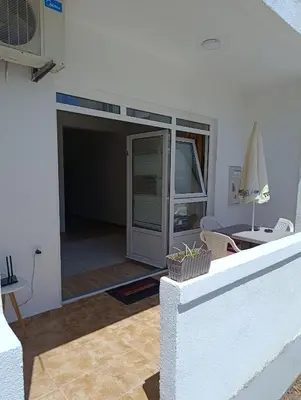a view of a living room with a sliding glass door at Villa Serenita in Ulcinj