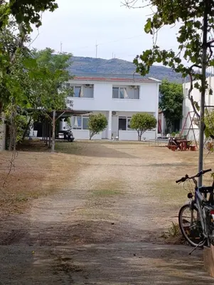 a house with a bike parked in front of it at Villa Serenita in Ulcinj