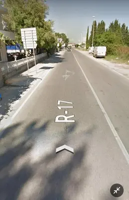 a street sign in the middle of a road at Villa Serenita in Ulcinj