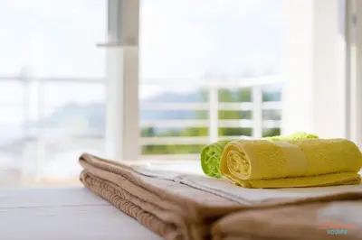 a pile of towels sitting on top of a table at Dubrava Sea View Apartments in Dobra Voda