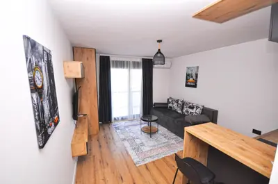a living room with a couch and a table at New Studio - Dobra Voda in Dobra Voda