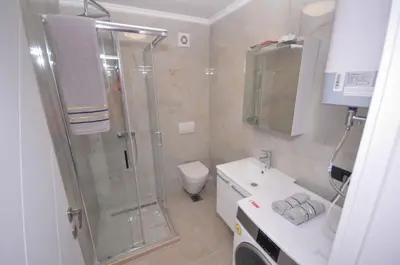 a bathroom with a shower and a toilet and a sink at New Studio - Dobra Voda in Dobra Voda