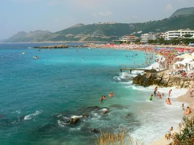 a group of people swimming in the water at a beach at New Studio - Dobra Voda in Dobra Voda