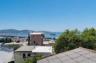 a view of a city with the ocean in the background at Your Adriatic Nest in Bar, Susanj