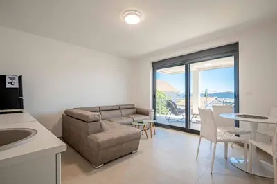 a living room with a couch and a table at Your Adriatic Nest in Bar, Susanj