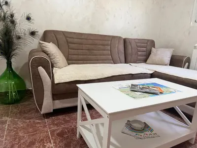 a living room with a couch and a table at Apartment Laganini-Bar in Bar, Susanj