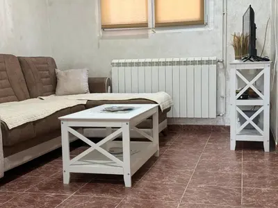 a living room with a couch and a table at Apartment Laganini-Bar in Bar, Susanj